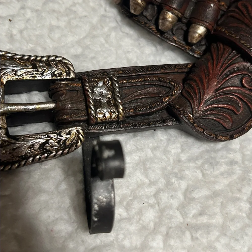 Gun belt wall hanger